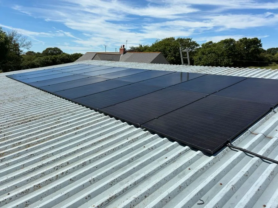 Solar panel installation on a metal roof near Helston, Cornwall